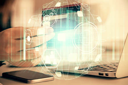Multi exposure of woman on-line shopping holding a credit card and social network theme drawing....