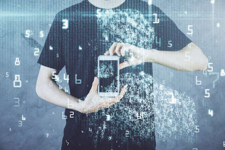 Double exposure of man's hand holding and using a digital device and data theme hologram drawing....