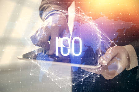 Double exposure of man's hands holding and using a phone and crypto currency blockchain theme drawing.の写真素材