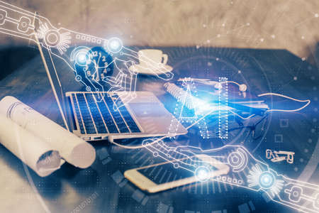 Double exposure of table with computer on background and data theme drawing. Concept of innovation.