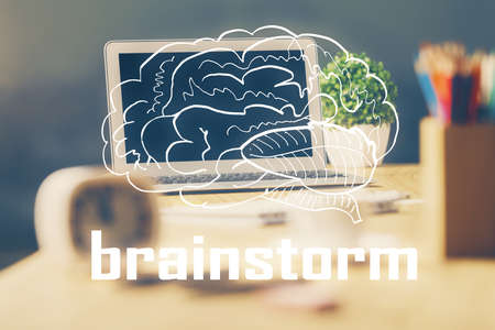 Desktop computer background in office and start up theme hologram drawing. Double exposure. Startup concept.の写真素材