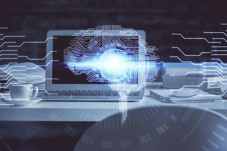 Double exposure of table with computer and brain hologram. Data innovation concept.