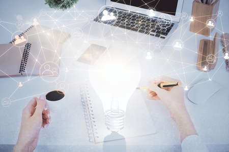 Social network theme hologram over hands taking notes background. Concept of global international...