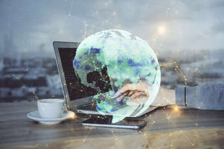 Media network theme hologram with man working on computer on background. Concept of internet communication. Double exposure.の写真素材