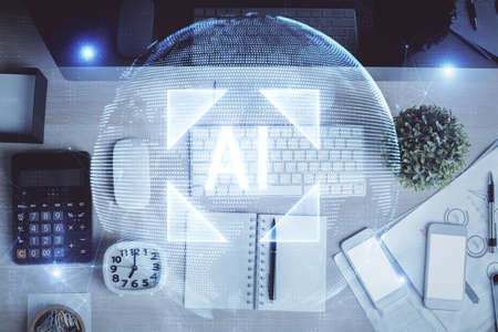 Multi exposure of data drawing hologram over topview of study desk background with computer. Concept of technology.の写真素材