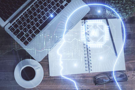 Double exposure of brain drawing hologram over topview work table background with computer. Concept...