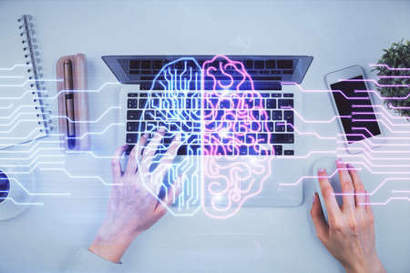 Double exposure of woman working on computer andhuman brain hologram drawing. Top View. Ai concept.