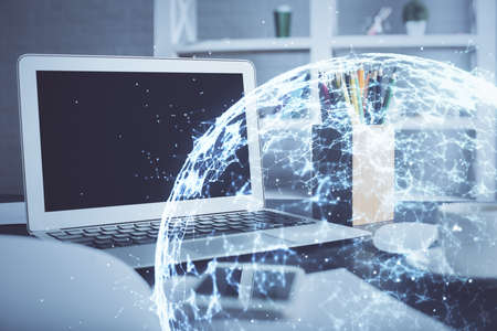 Computer on desktop with social network hologram. Double exposure. Concept of international people connections.の写真素材