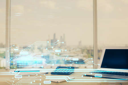 Double exposure of desktop computer and technology theme hologram. Concept of software development.