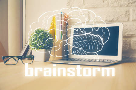 Desktop computer background in office and start up theme hologram drawing. Double exposure. Startup concept.の写真素材