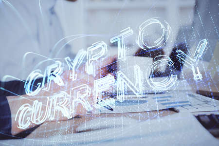Man's hands working with notes background. Cryptocurrency and finance concept. Double exposure.の写真素材