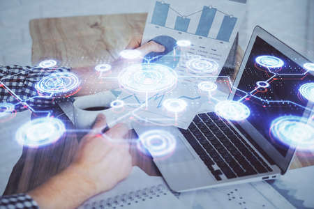 Media network theme hologram with man working on computer on background. Concept of internet...