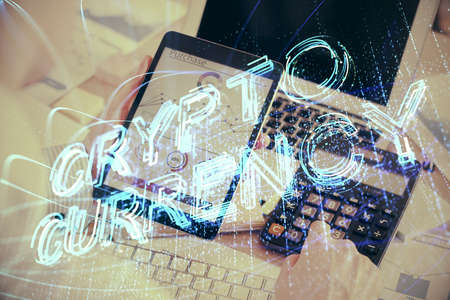 Double exposure of mans hands holding and using a phone and crypto currency blockchain theme...