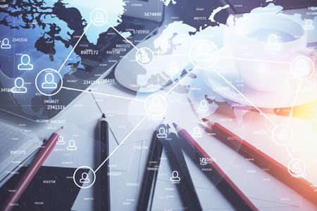 Computer on desktop with social network hologram. Double exposure. Concept of international people...