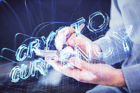 Mans hands working with notes background. Cryptocurrency and finance concept. Double exposure.の写真素材
