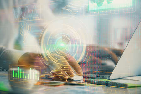 Businessman with computer background with technology theme hologram. Concept of hightech. Multi...
