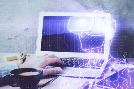 AR hologram with man working on computer on background. Augmented reality concept. Double exposure.