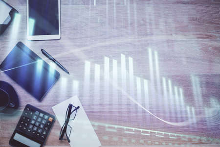 Double exposure of forex graph drawing and work table top veiw. Concept of financial analysis.