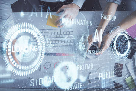 Double exposure of man and woman working together and data theme hologram drawing. Computer...