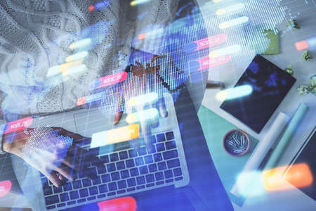 Double exposure of woman hands working on computer and data theme hologram drawing. Top View....