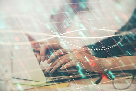 Multi exposure of woman hands typing on computer and financial graph hologram drawing. Stock market...