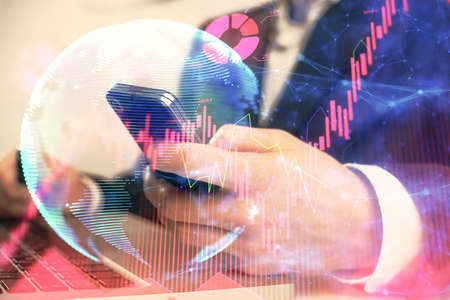 Double exposure of mans hands holding and using a phone and international business theme drawing.