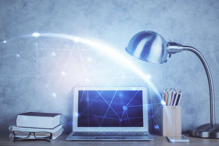 Computer on desktop with social network hologram. Double exposure. Concept of international people connections.の写真素材