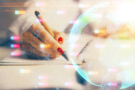 Multi exposure of hands making notes with world map hologram and data theme icons. Concept of global data.の写真素材