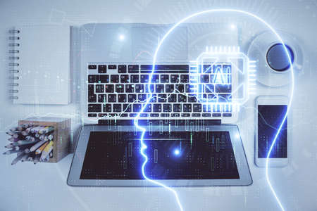 Double exposure of brain drawing hologram over topview work table background with computer. Concept...