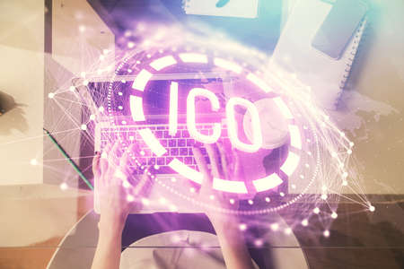 Double exposure of woman hands working on computer and blockchain theme hologram drawing. Top View....
