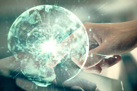 Double exposure of mans hands holding and using a phone and international business theme drawing.の写真素材