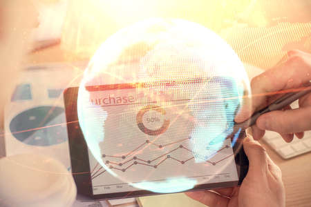 Double exposure of mans hands holding and using a phone and international business theme drawing.