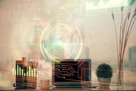 Double exposure of table with computer on background and data theme hologram. Data technology...