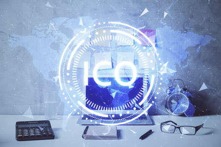 Double exposure of blockchain and crypto economy theme hologram and table with computer background. Concept of bitcoin cryptocurrency.の写真素材
