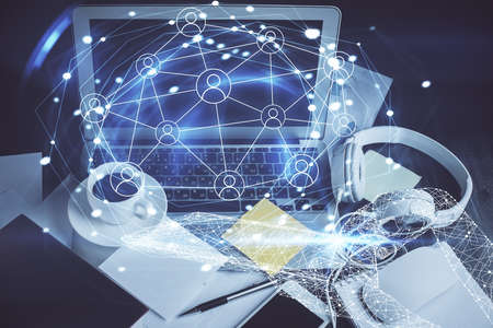 Computer on desktop with social network hologram. Double exposure. Concept of international people...