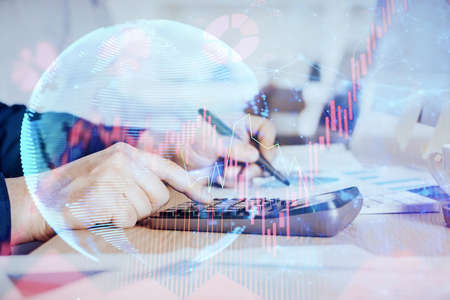 Double exposure of Man writing in notepad with business icons on background. Concept of...