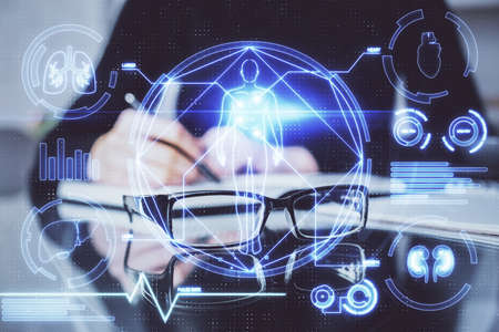 Education theme hologram over womans hands writing background. Concept of study. Double exposure
