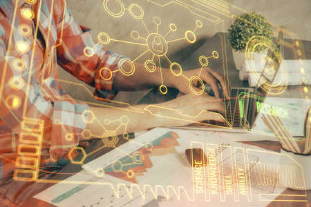 Double exposure of technology hologram with man working on computer background. Concept of big data.の写真素材