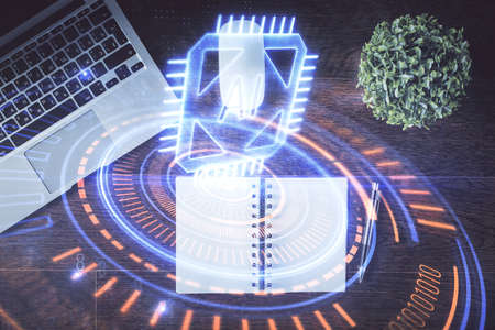 Double exposure of data theme drawing hologram over topview work table background with computer....