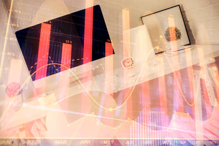 Double exposure of financial graph drawing and office interior background. Concept of stock market.