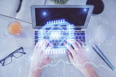 Multi exposure of mans hands typing over computer keyboard and data theme hologram drawing. Top...