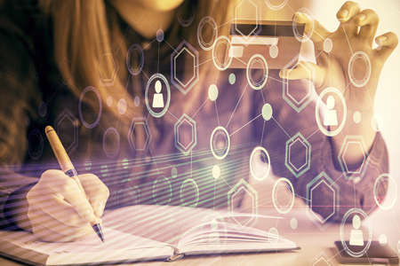 Multi exposure of woman on-line shopping holding a credit card and social network theme drawing....