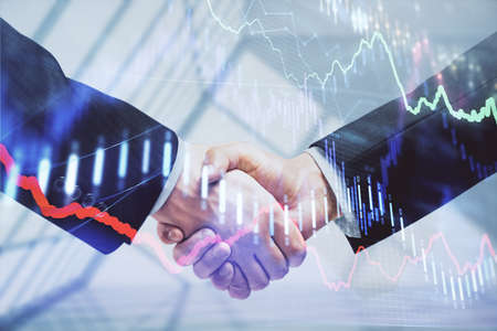 Double exposure of forex graph hologram and handshake of two men. Stock market concept.