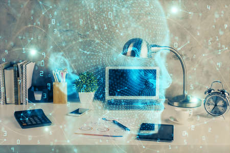 Double exposure of desktop with computer and brain drawing hologram. Artificial intelligence...