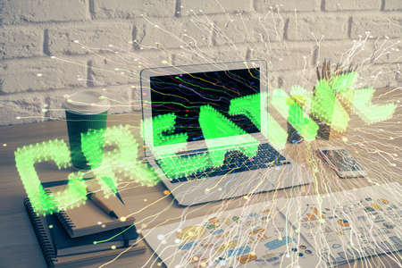 Desktop computer background in office and start up theme hologram drawing. Double exposure. Startup...