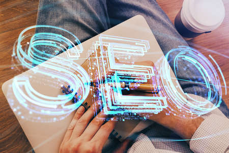 Mans hands with seo theme double exposure icon. Concept of search optimization.
