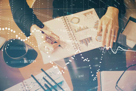 Multi exposure of womans writing hand on background with data technology hud. Big data concept.