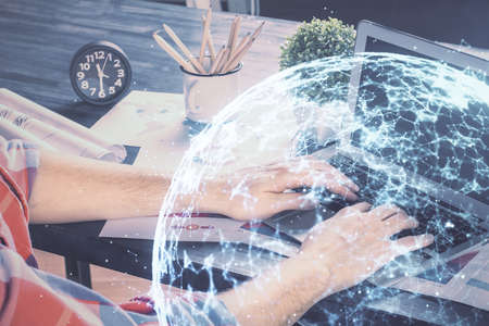 Media network theme hologram with man working on computer on background. Concept of internet...