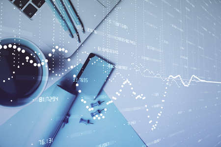 Multi exposure of data drawing hologram over topview of study desk background with computer. Concept...