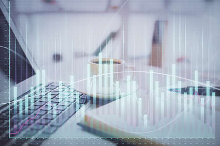 Double exposure of financial chart drawing and desktop with coffee and items on table background....